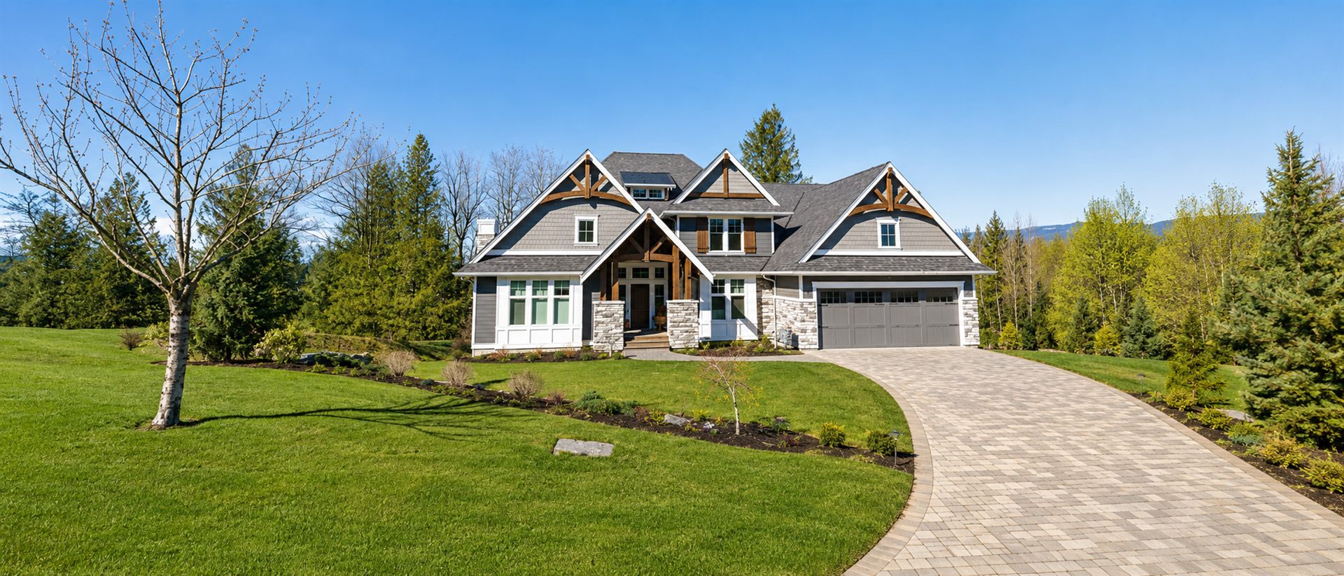 Custom home with paver driveway